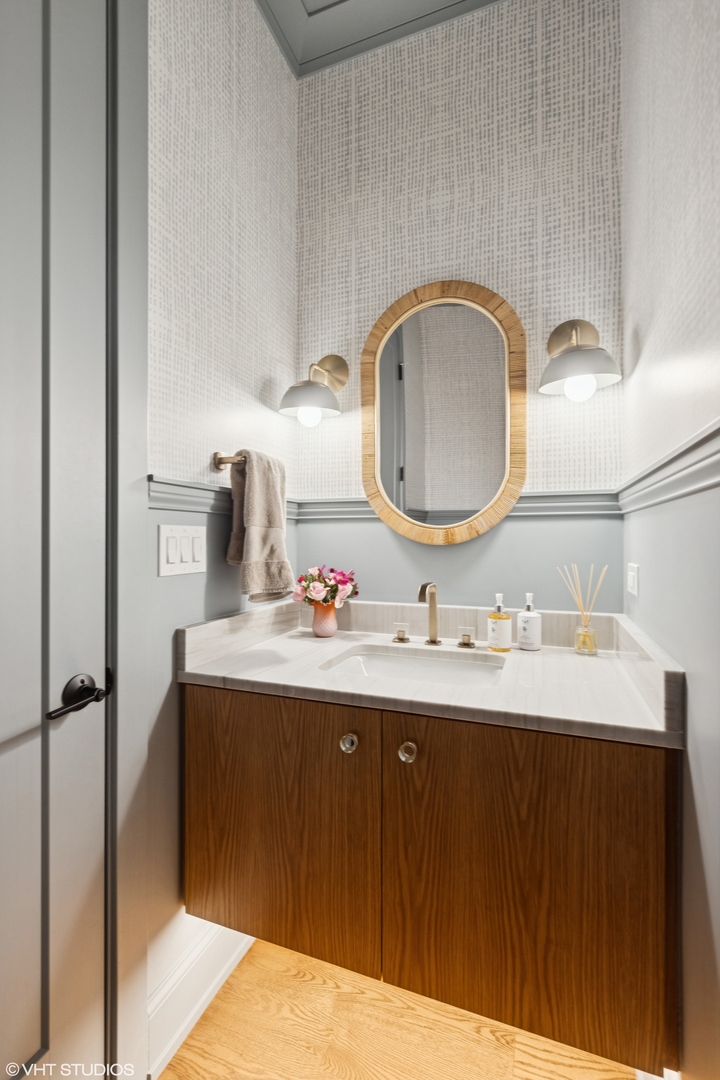 4320 Howard Avenue Western Springs, IL 60558 - Photo 7 of 20 a bathroom with a sink and a mirror