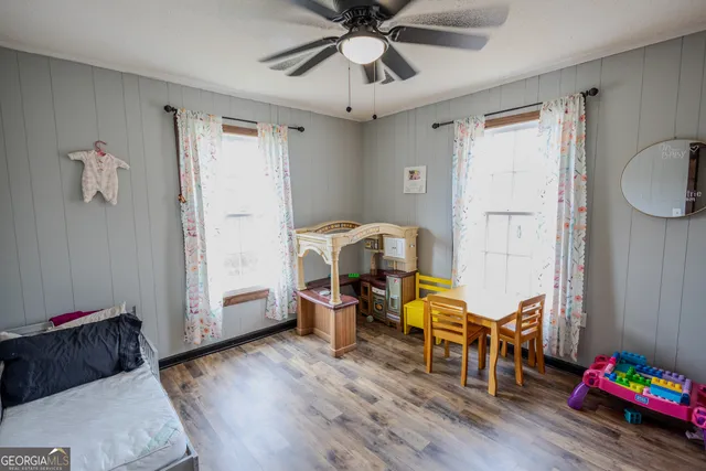 a room with furniture and wooden floor