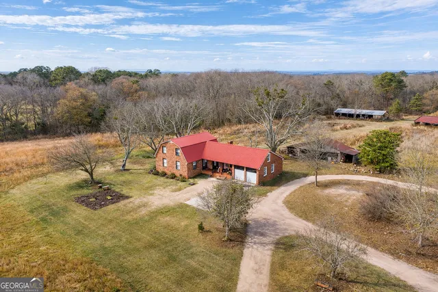 a view of a swimming pool with a yard