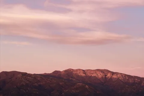 a view of mountains and valleys