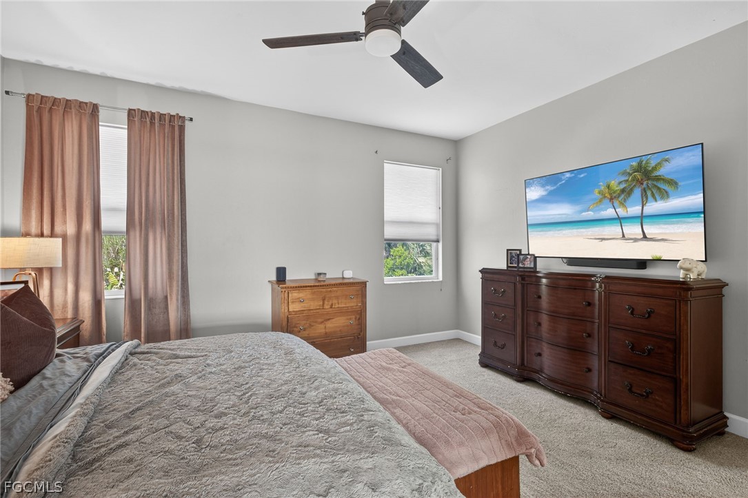 22866 Forest Ridge Drive Estero, FL 33928 - Photo 19 of 38 a bedroom with a bed and a dresser