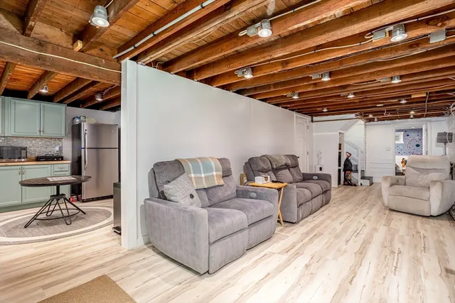 a living room with furniture and a view of chandelier