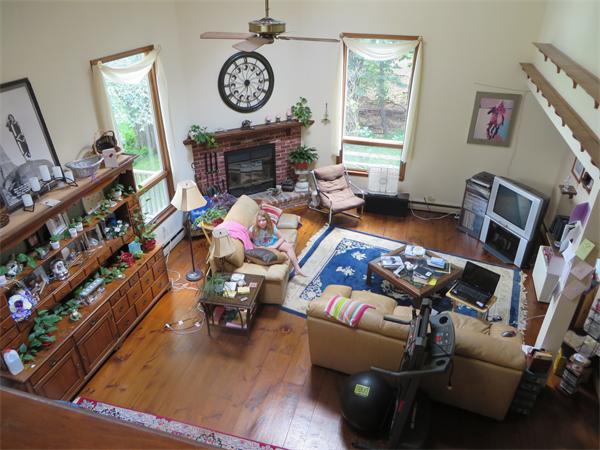 11 Modoc Heath, MA 01346 - Photo 11 of 21 a living room with furniture a window entryway and a fireplace
