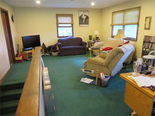 11 Modoc Heath, MA 01346 - Photo 13 of 21 a living room with furniture and a flat screen tv