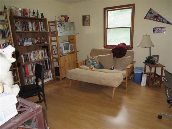 11 Modoc Heath, MA 01346 - Photo 14 of 21 a living room with furniture and a book shelf