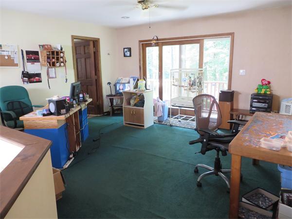 11 Modoc Heath, MA 01346 - Photo 15 of 21 a view of a livingroom with workspace and a window