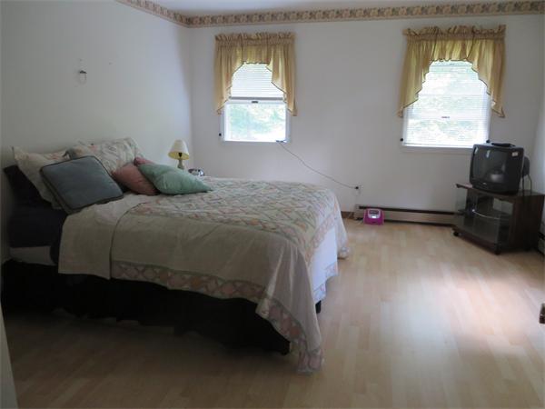 11 Modoc Heath, MA 01346 - Photo 17 of 21 a bed sitting in a bedroom next to a window