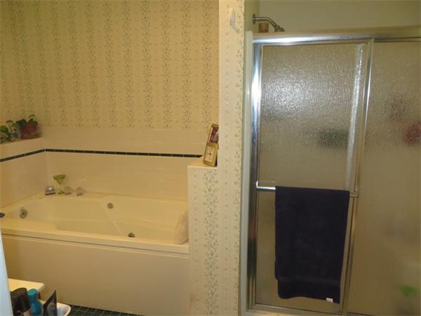 11 Modoc Heath, MA 01346 - Photo 18 of 21 a bathroom with a bathtub and a shower