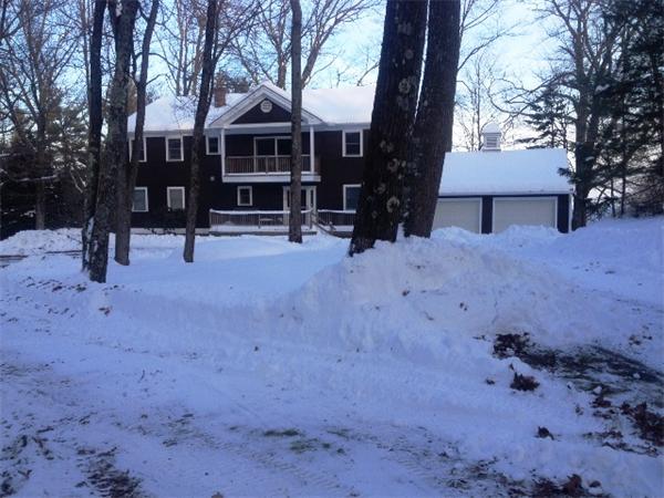 11 Modoc Heath, MA 01346 - Photo 2 of 21 a view of a house with a yard covered in snow