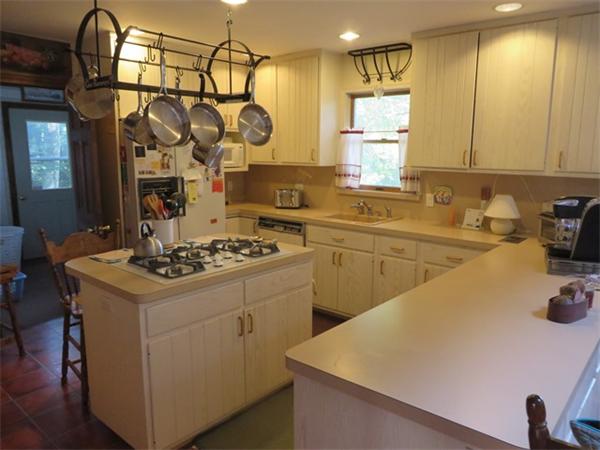 11 Modoc Heath, MA 01346 - Photo 7 of 21 a kitchen with a sink a stove and cabinets