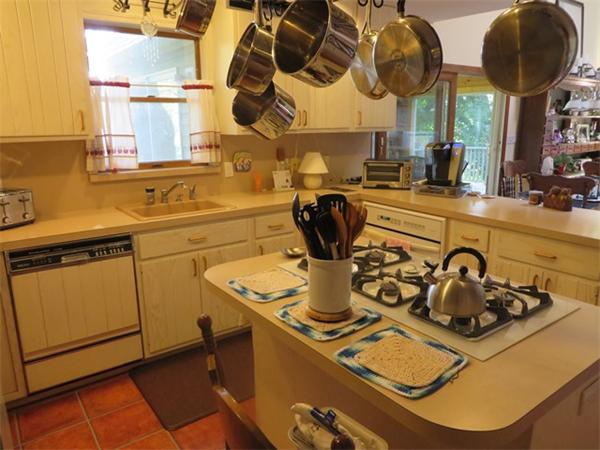 11 Modoc Heath, MA 01346 - Photo 8 of 21 a kitchen with a sink a stove and a wooden floor