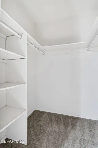 a bathroom with a toilet sink and shower