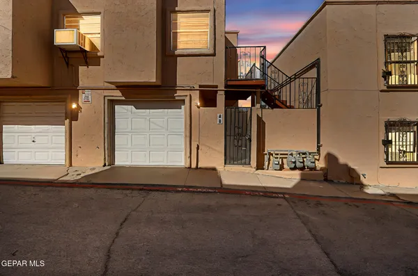 a view of a house with a street