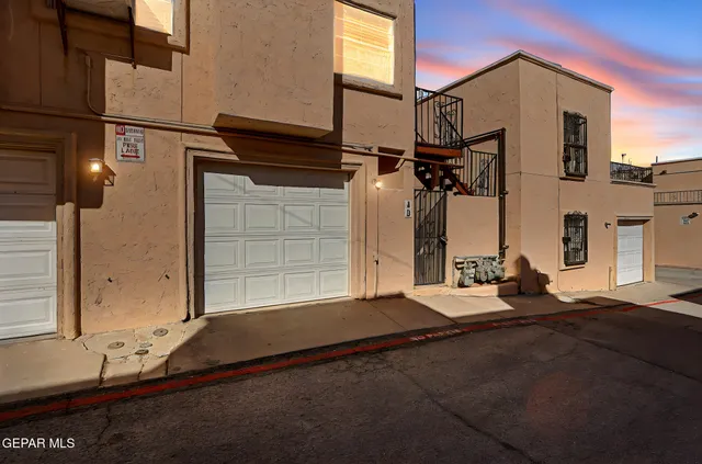 a view of a house with a snow on the road