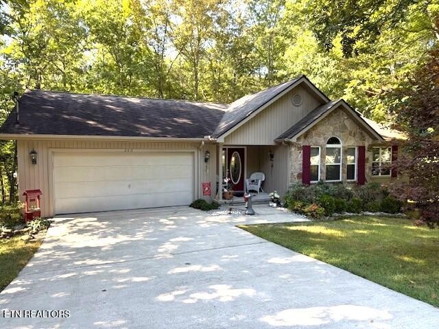 246 St George Drive Crossville, TN 38558 - Photo 1 of 25 a front view of a house with yard and green space