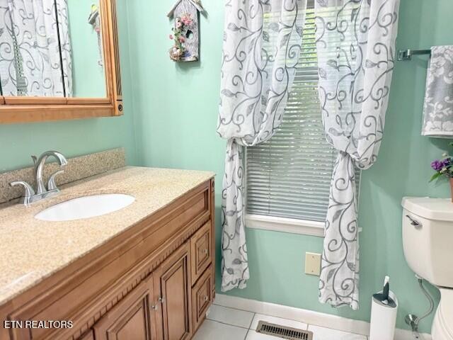 246 St George Drive Crossville, TN 38558 - Photo 13 of 25 a bathroom with a sink a toilet and a mirror
