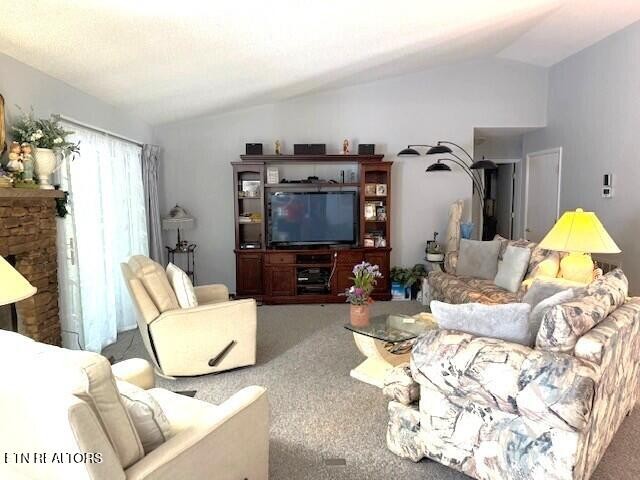 246 St George Drive Crossville, TN 38558 - Photo 4 of 25 a living room with furniture and a flat screen tv