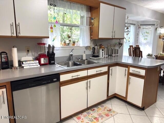 246 St George Drive Crossville, TN 38558 - Photo 10 of 25 a kitchen with stainless steel appliances a sink window and cabinets