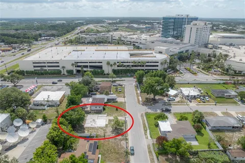 an aerial view of a house with outdoor space