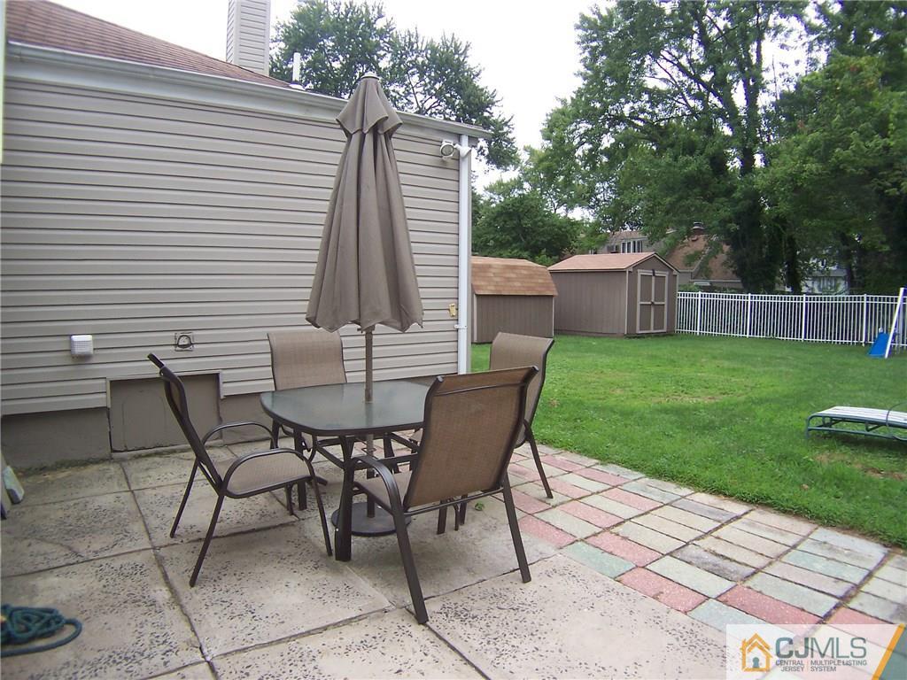 14 West Cliff Road Colonia, NJ 07067 - Photo 16 of 18 a view of a backyard with furniture and garden
