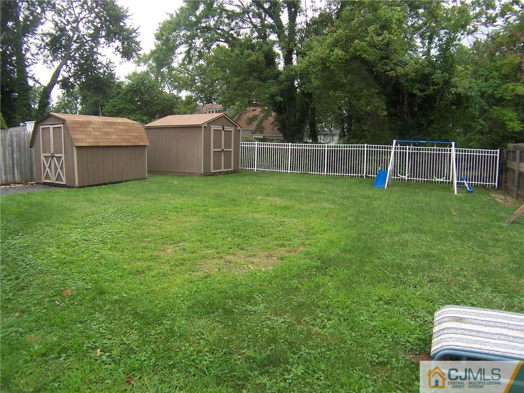 14 West Cliff Road Colonia, NJ 07067 - Photo 17 of 18 a view of a backyard with fence