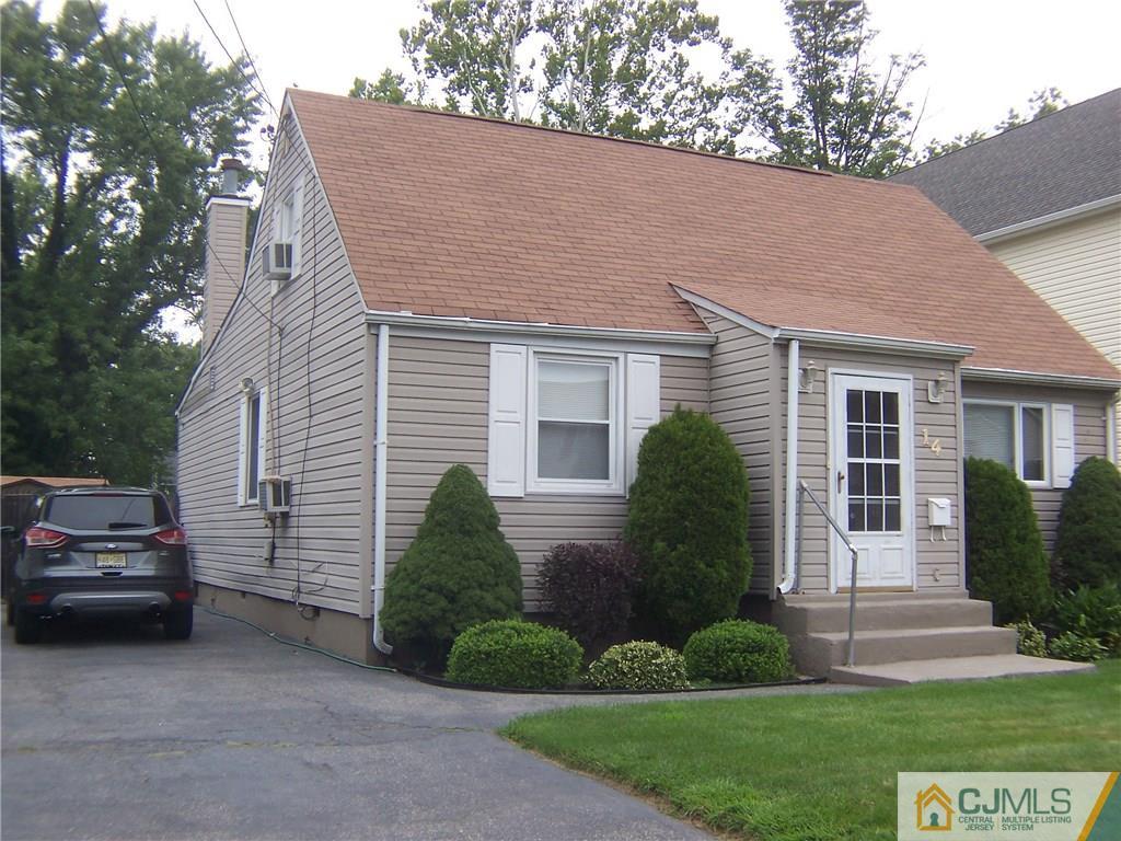 14 West Cliff Road Colonia, NJ 07067 - Photo 18 of 18 a view of a house with a yard plants and a large tree