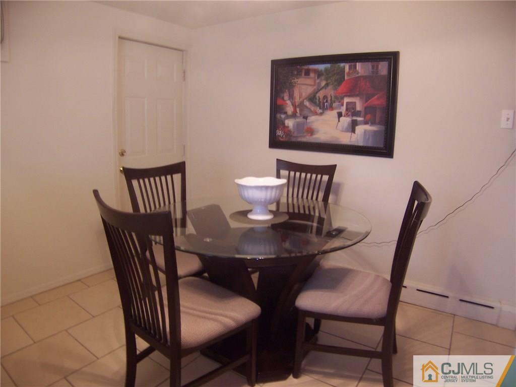 14 West Cliff Road Colonia, NJ 07067 - Photo 5 of 18 a view of a dining room with furniture and wooden floor