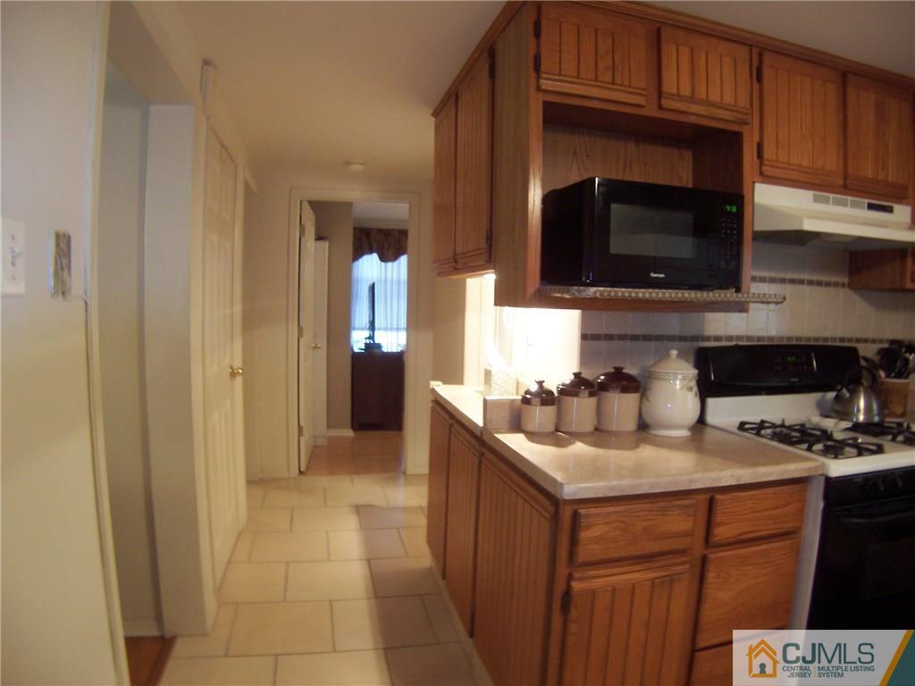 14 West Cliff Road Colonia, NJ 07067 - Photo 6 of 18 a kitchen with a sink and cabinets