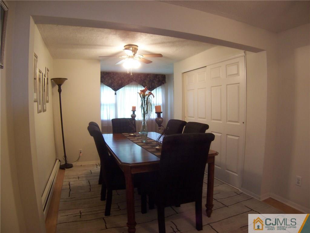 14 West Cliff Road Colonia, NJ 07067 - Photo 8 of 18 a view of a dining room with furniture and window