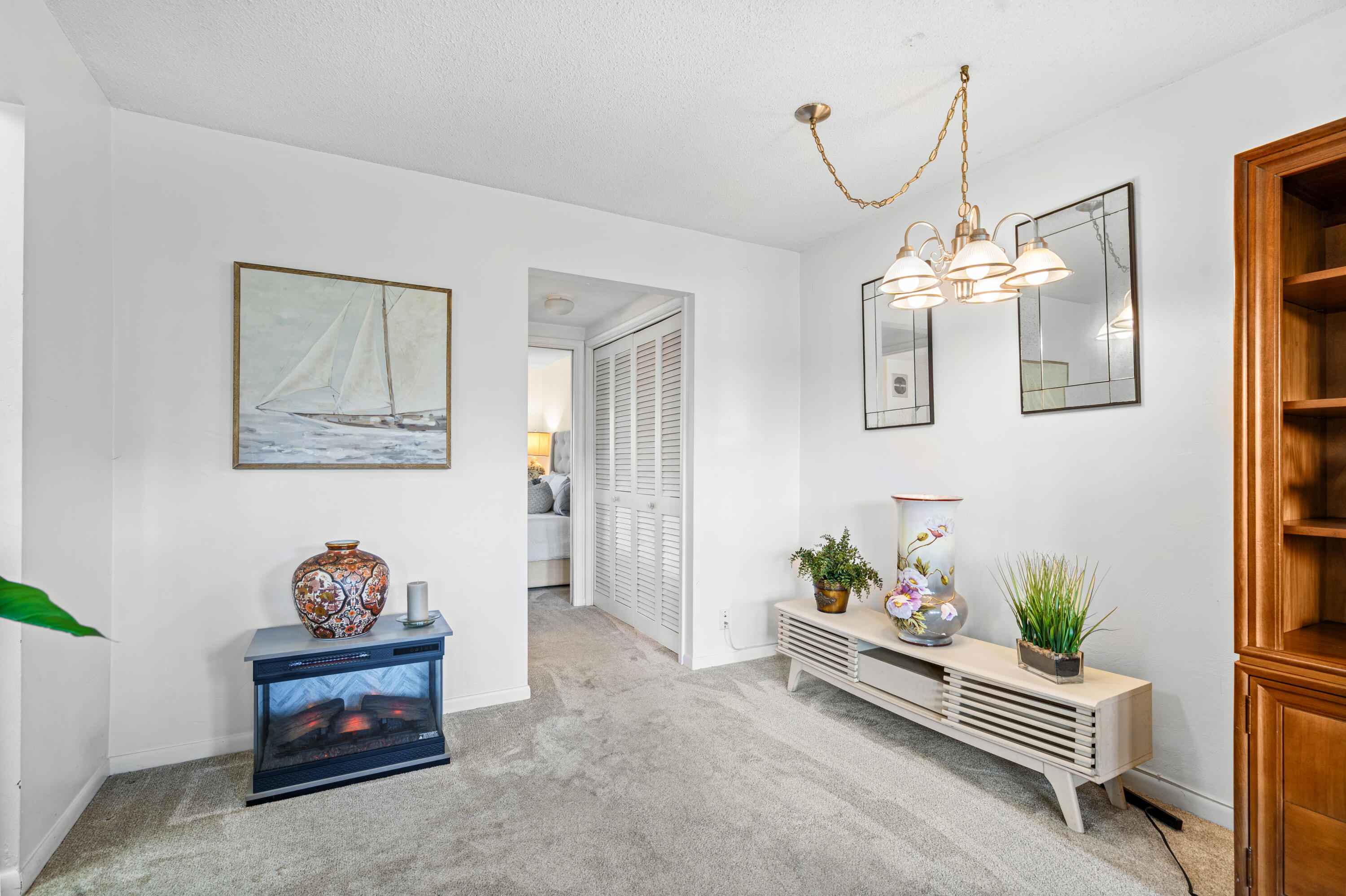 320 Horizon West, Unit 103 Boynton Beach, FL 33435 - Photo 14 of 24 a living room with furniture and a potted plant