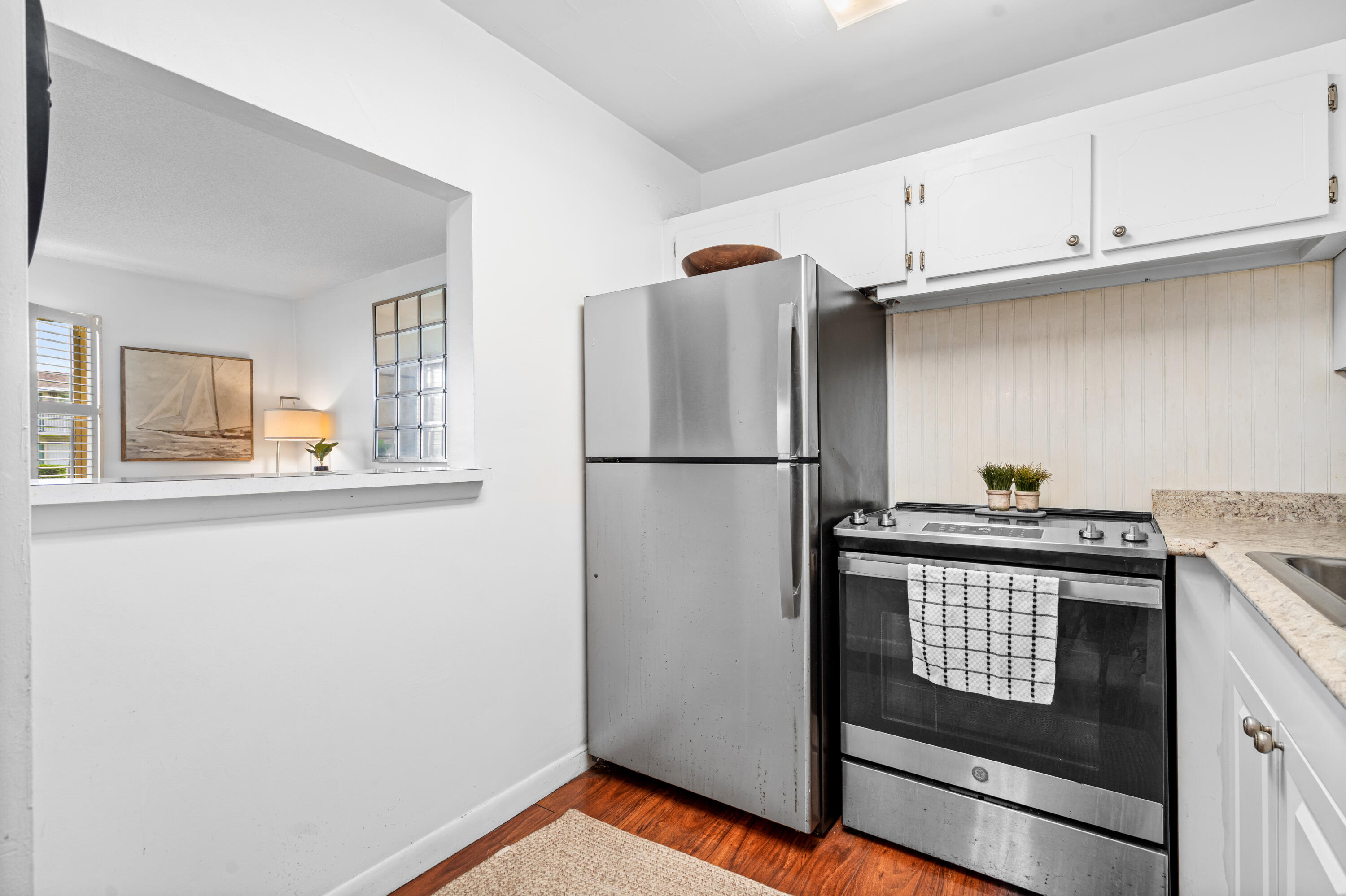320 Horizon West, Unit 103 Boynton Beach, FL 33435 - Photo 4 of 24 a view of a kitchen with electric appliances