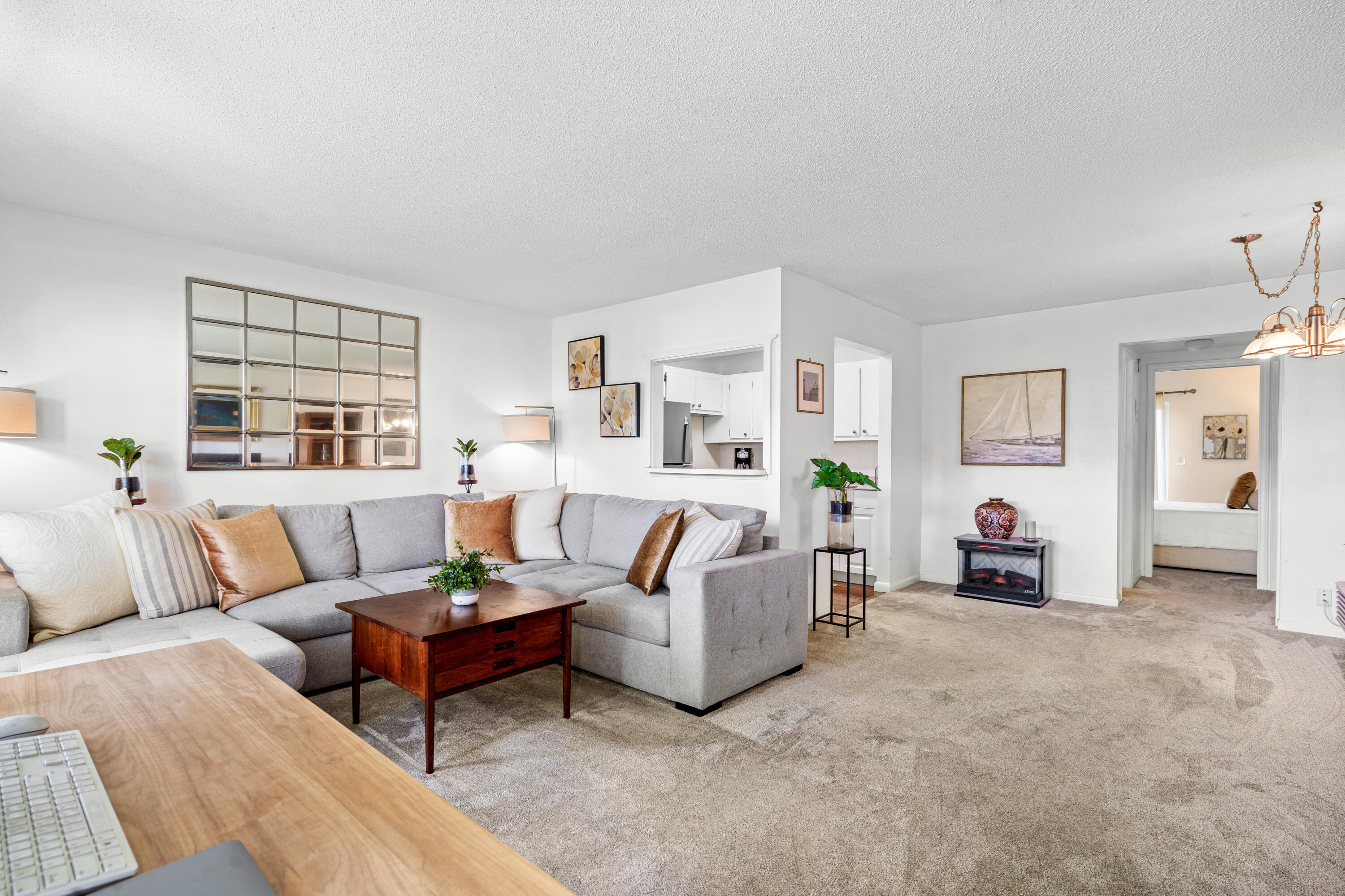320 Horizon West, Unit 103 Boynton Beach, FL 33435 - Photo 6 of 24 a living room with furniture and a flat screen tv