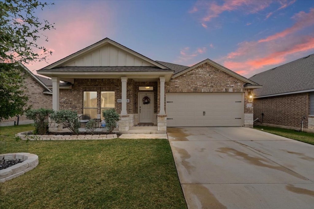 6326 Matagorda Road Belton, TX 76513 - Photo 3 of 14 a front view of a house with a yard garage and outdoor seating