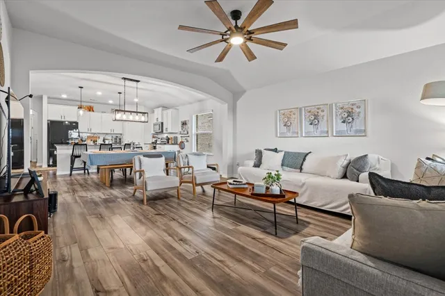 a living room with furniture and a large window