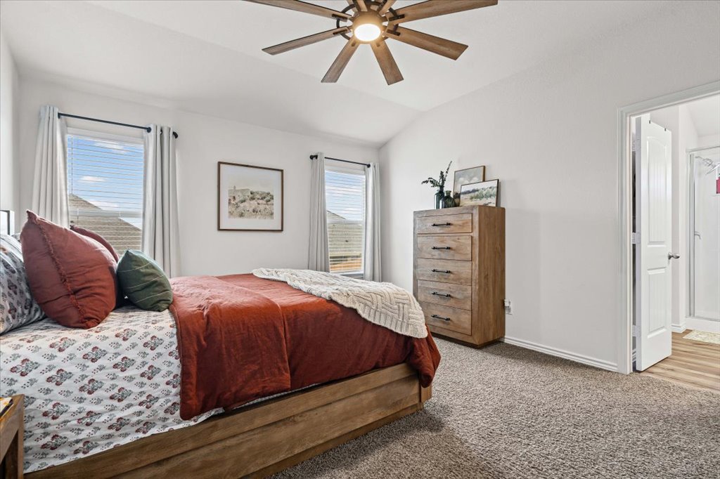 6326 Matagorda Road Belton, TX 76513 - Photo 8 of 14 a bedroom with a bed and a chandelier