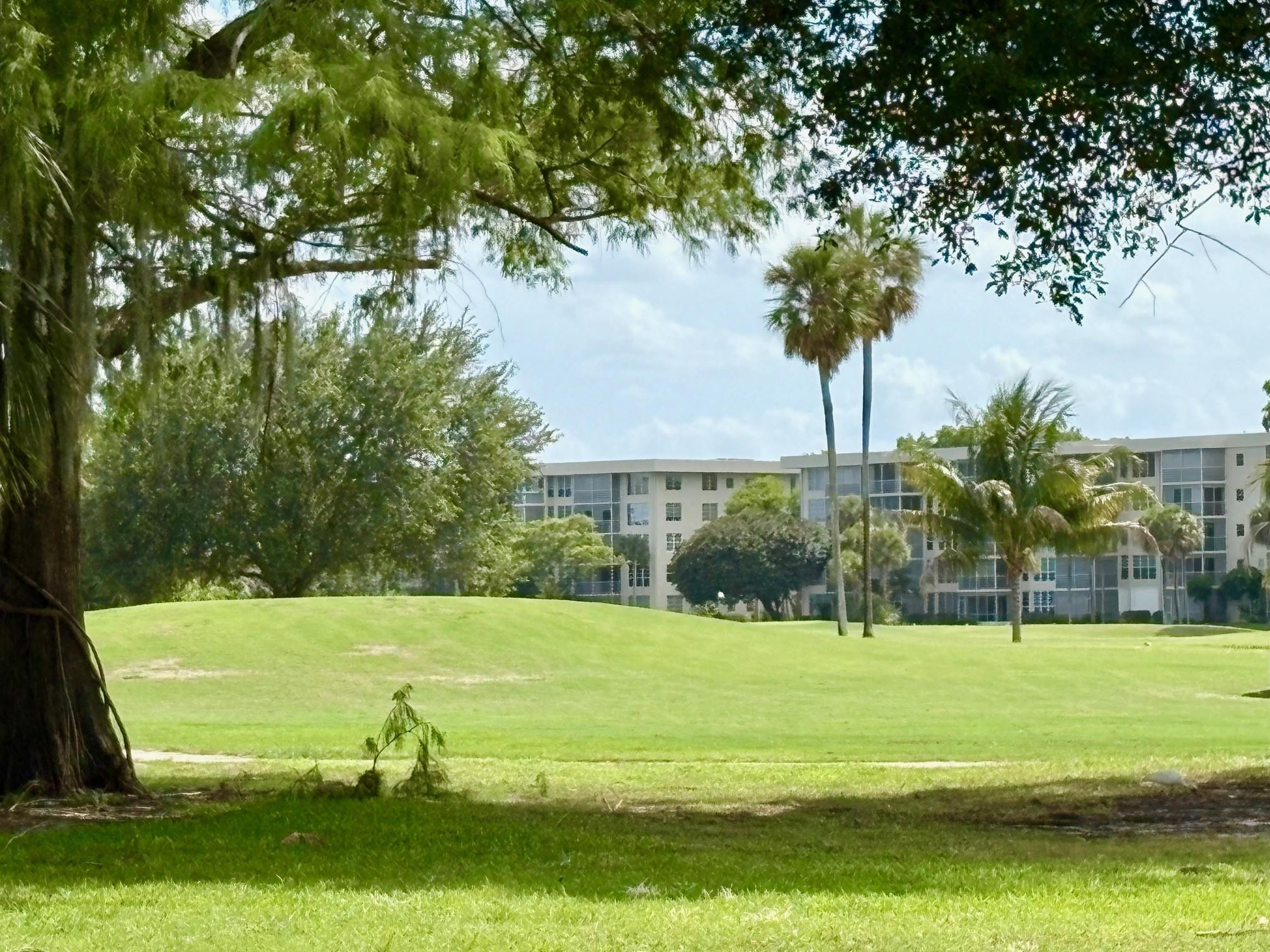 2671 South Course Drive, Unit 108 Pompano Beach, FL 33069 - Photo 37 of 40 a view of a park with large trees