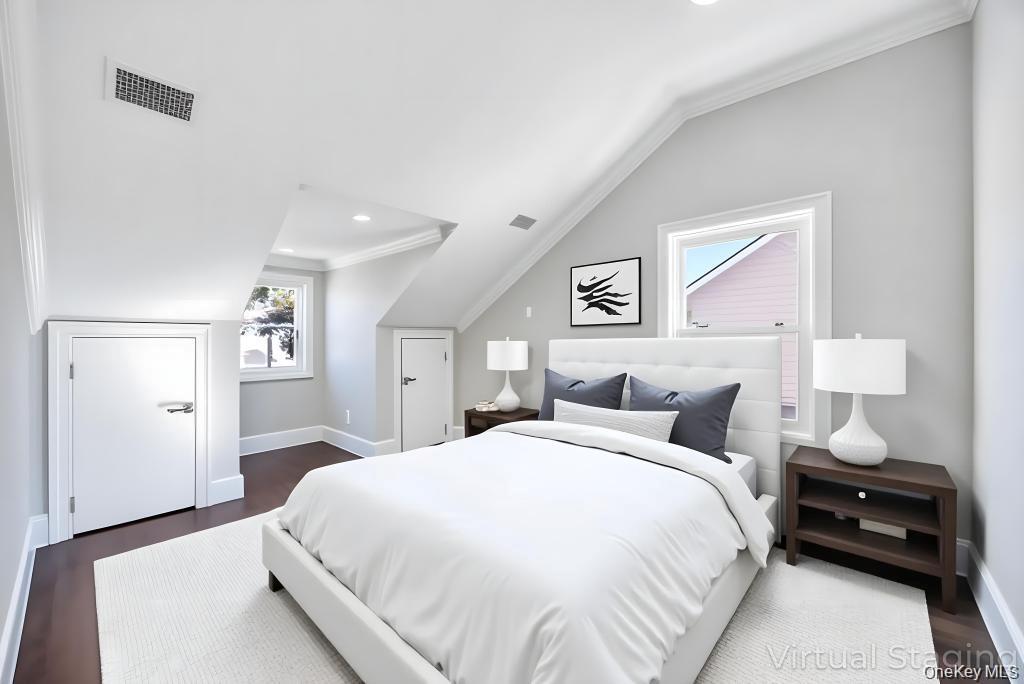 41 Perry Street Hempstead, NY 11550 - Photo 12 of 36 Bedroom with crown molding, vaulted ceiling, dark wood-style flooring, and recessed lighting