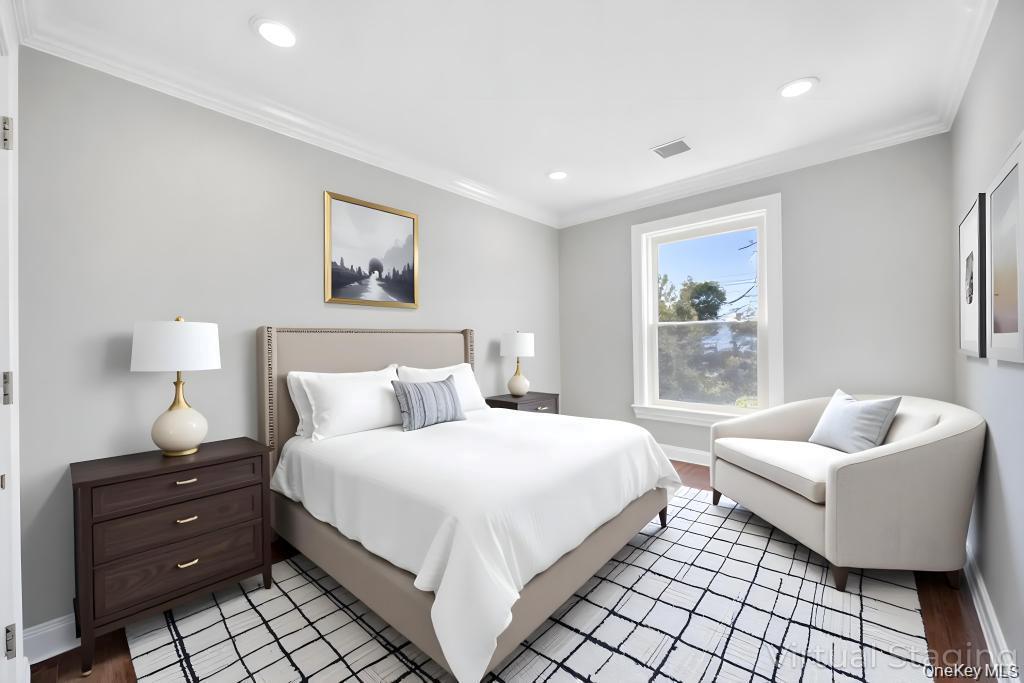 41 Perry Street Hempstead, NY 11550 - Photo 15 of 36 Bedroom with crown molding and recessed lighting
