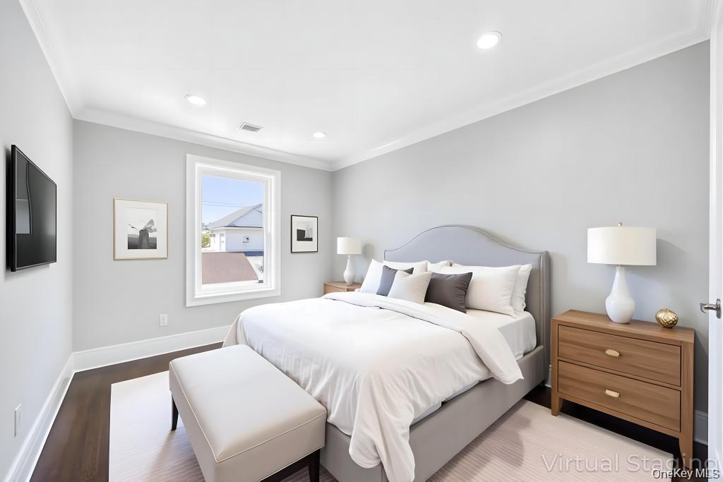 41 Perry Street Hempstead, NY 11550 - Photo 22 of 36 Bedroom with wood finished floors, ornamental molding, and recessed lighting