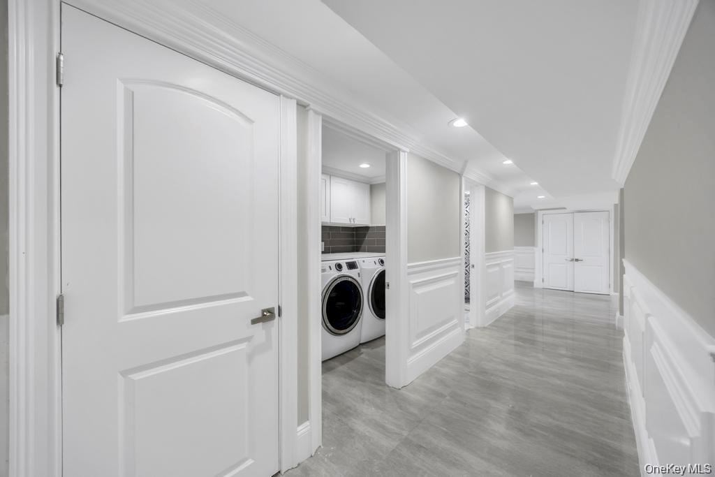41 Perry Street Hempstead, NY 11550 - Photo 29 of 36 Laundry area with a decorative wall, wainscoting, crown molding, separate washer and dryer, and recessed lighting