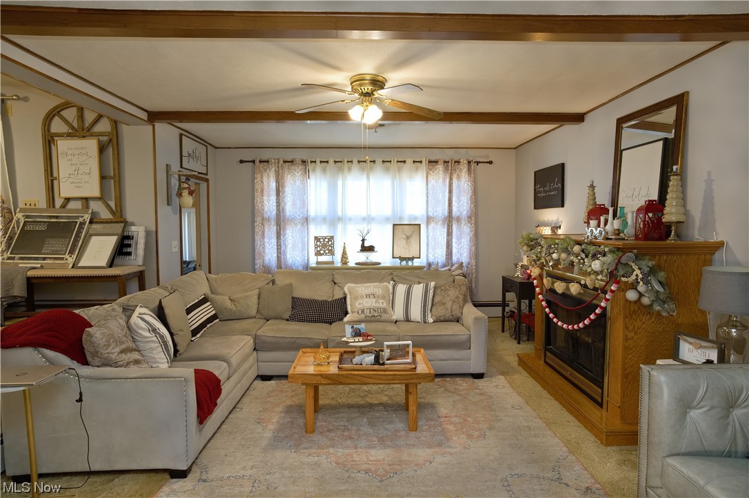 4061 Marks Rootstown, OH 44272 - Photo 6 of 25 Living room with beamed ceiling and ceiling fan
