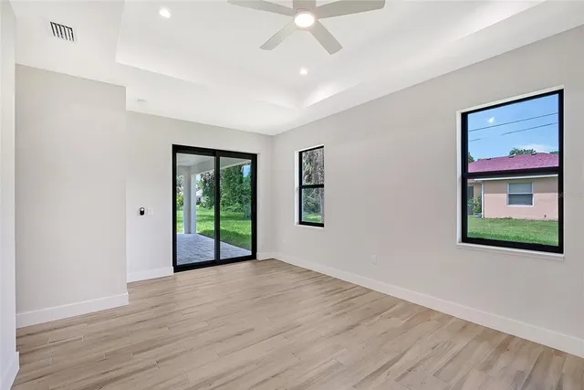 wooden floor in an empty room with a window