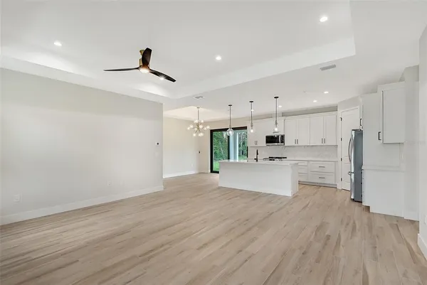 a view of kitchen with wooden floor and window