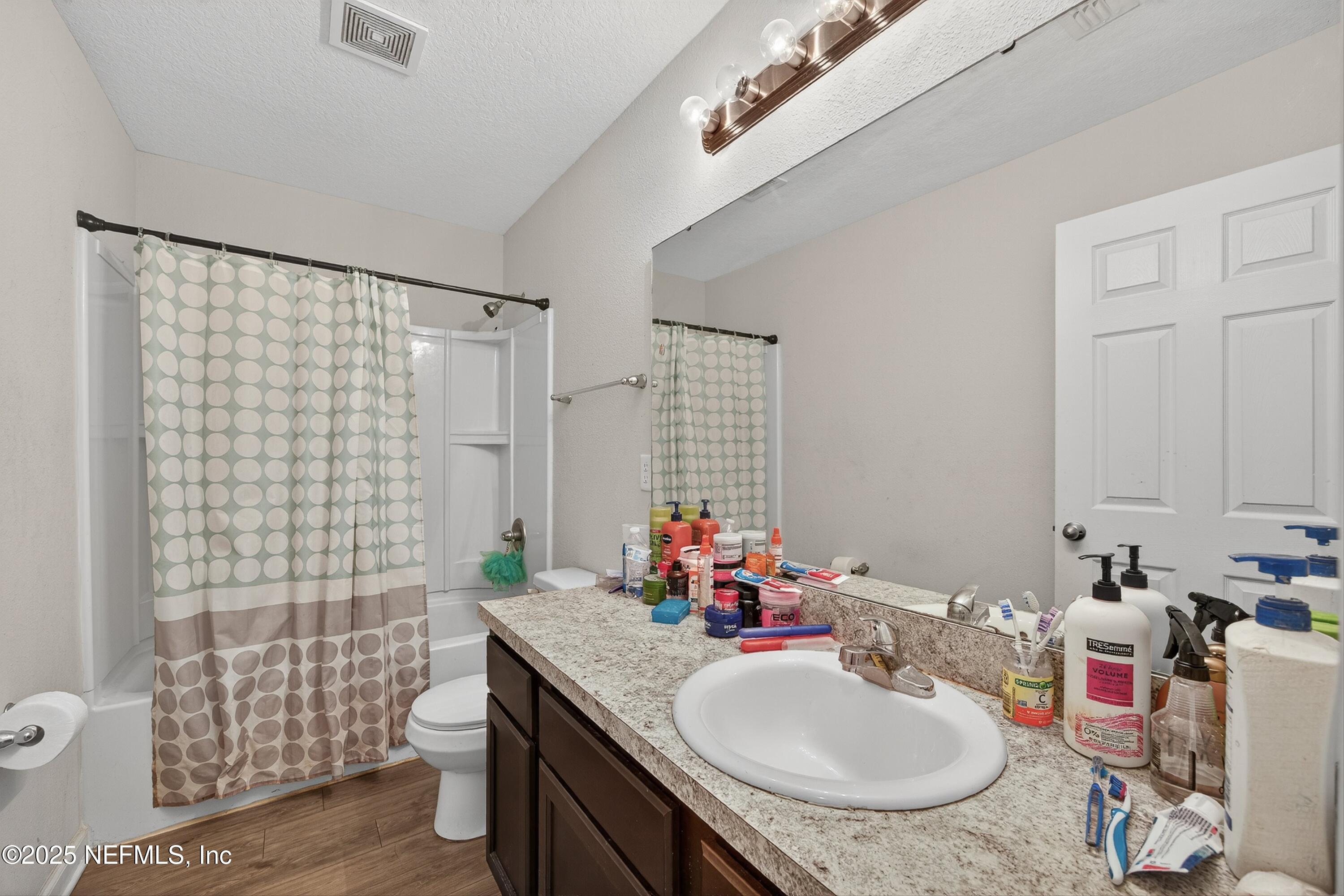756 Talking Tree Drive Jacksonville, FL 32205 - Photo 5 of 26 a bathroom with a sink vanity granite and toilet