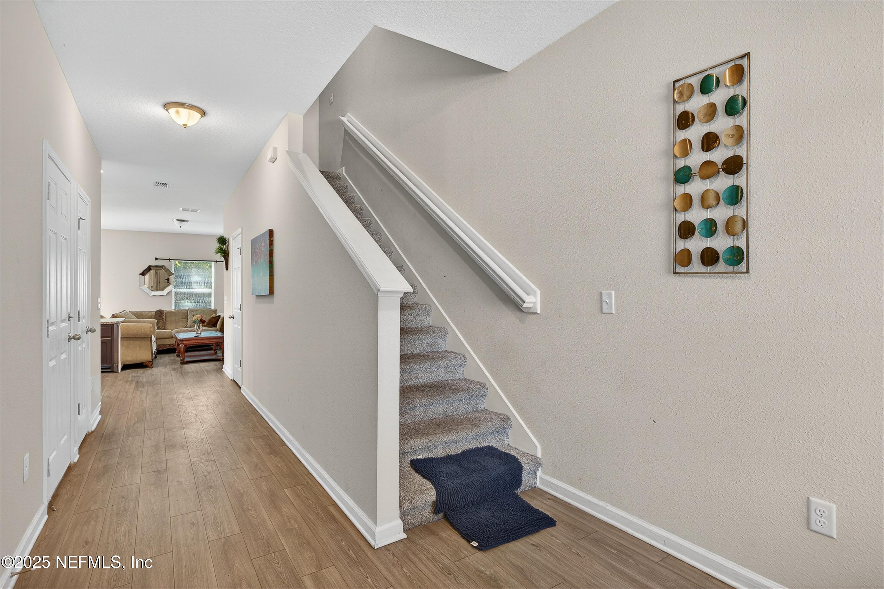 756 Talking Tree Drive Jacksonville, FL 32205 - Photo 8 of 26 a view of entryway and hall with wooden floor