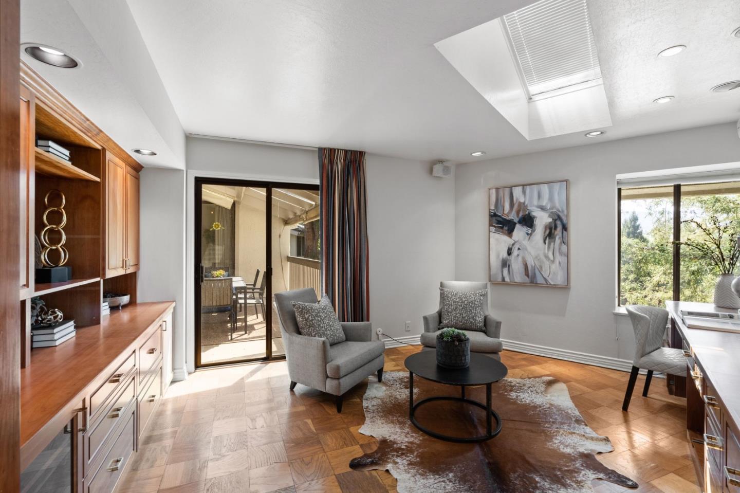 300 Sand Hill Circle, Unit 303 Menlo Park, CA 94025 - Photo 14 of 33 a living room with furniture stove and a large window