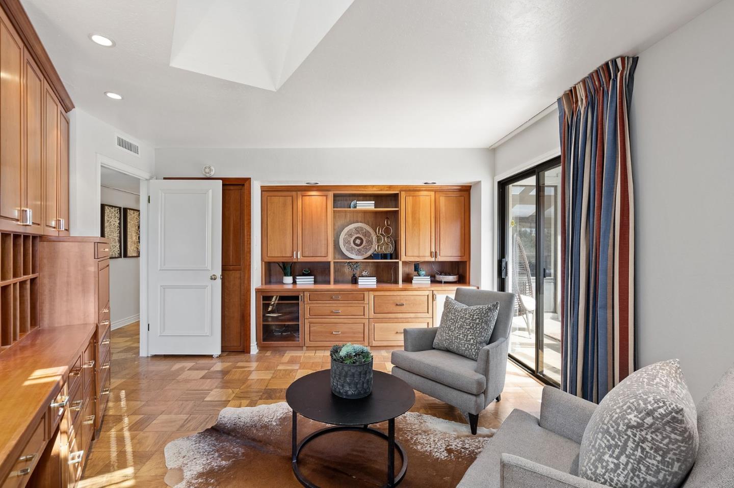 300 Sand Hill Circle, Unit 303 Menlo Park, CA 94025 - Photo 16 of 33 a living room with furniture and a large window