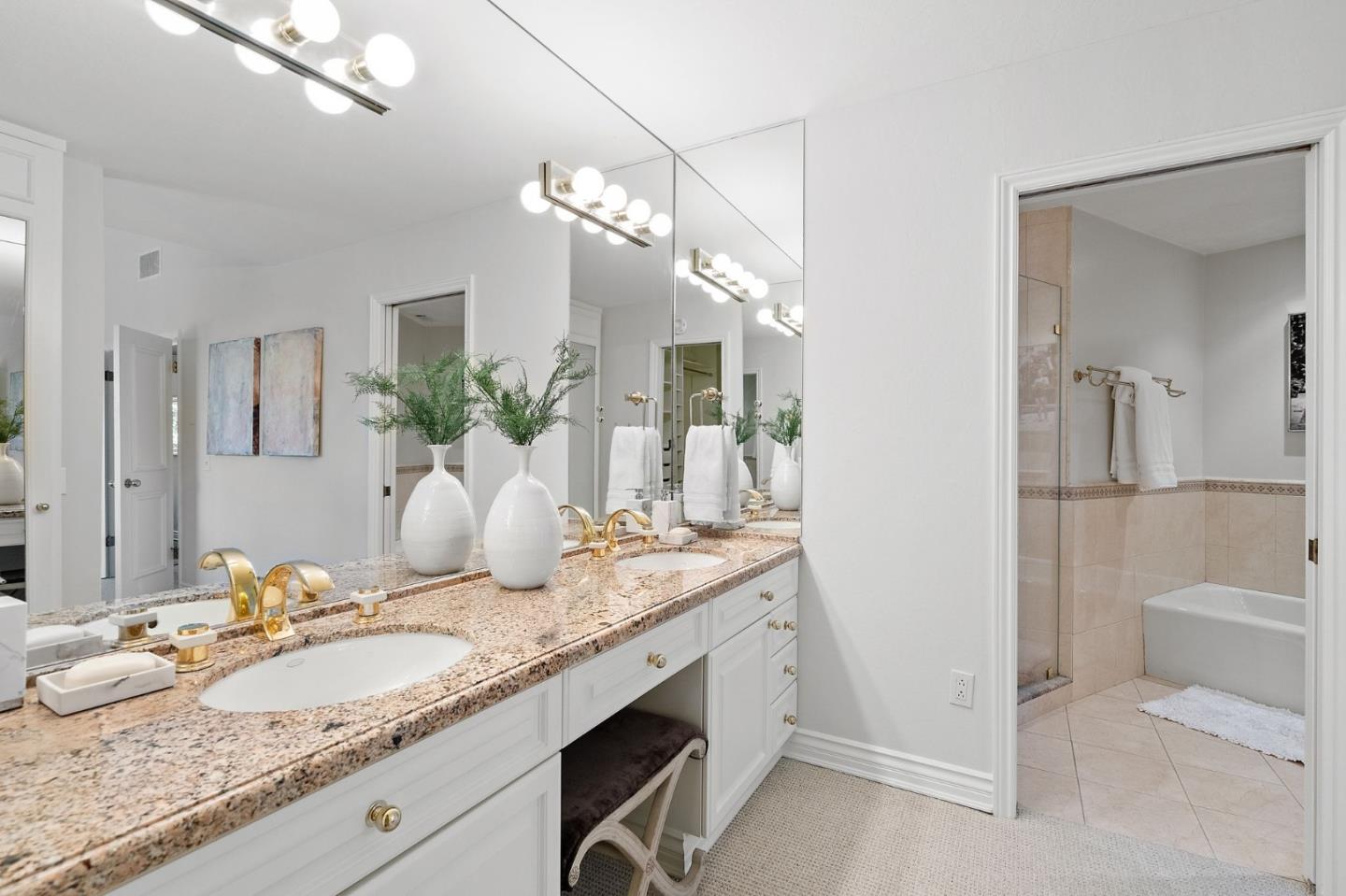 300 Sand Hill Circle, Unit 303 Menlo Park, CA 94025 - Photo 23 of 33 a bathroom with a granite countertop sink and a mirror