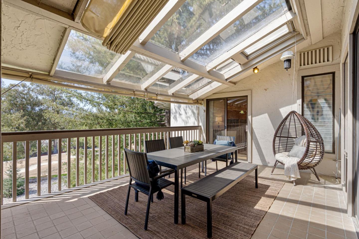 300 Sand Hill Circle, Unit 303 Menlo Park, CA 94025 - Photo 27 of 33 a view of a patio with table and chairs with wooden floor and fence