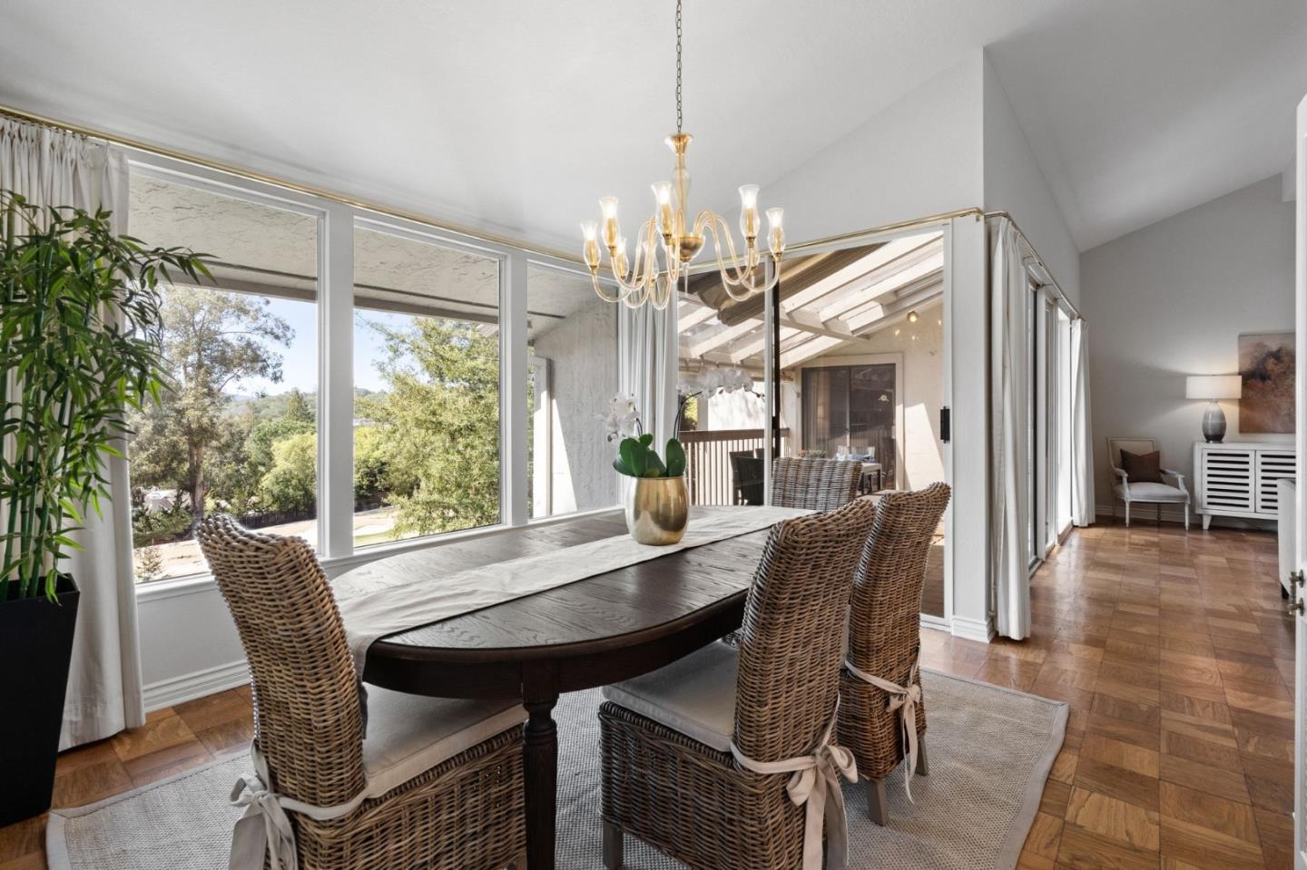 300 Sand Hill Circle, Unit 303 Menlo Park, CA 94025 - Photo 4 of 33 a dining room with furniture a chandelier and wooden floor